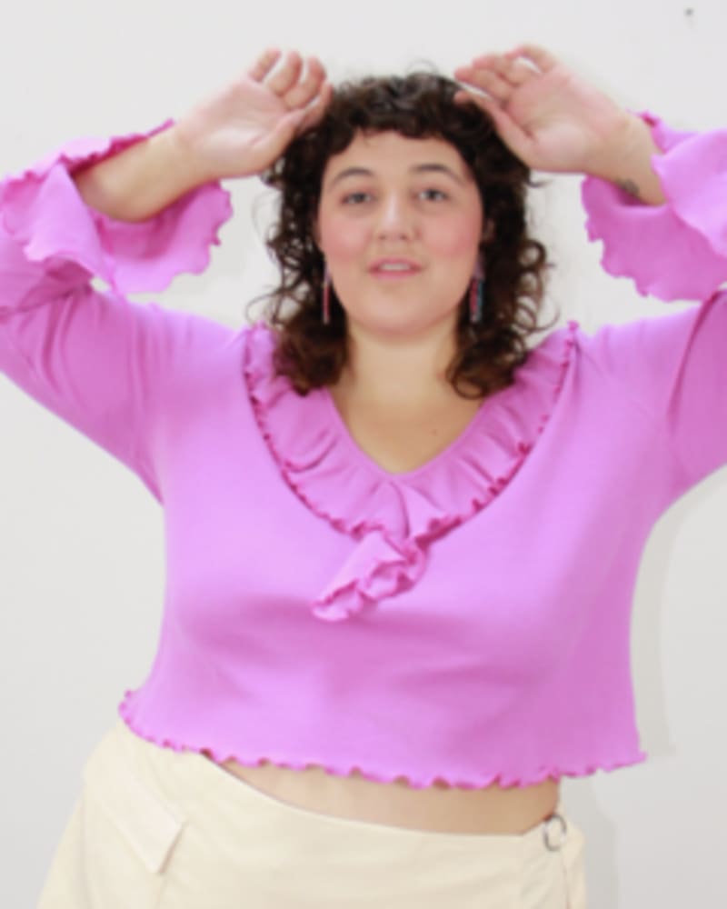 Front of a model wearing a size L Dazed Ruffled Top in Bloom by Lovefool. | dia_product_style_image_id:249543